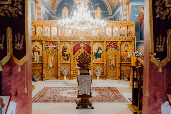 Russian Orthodox church with a chandelier and religious icons with saints