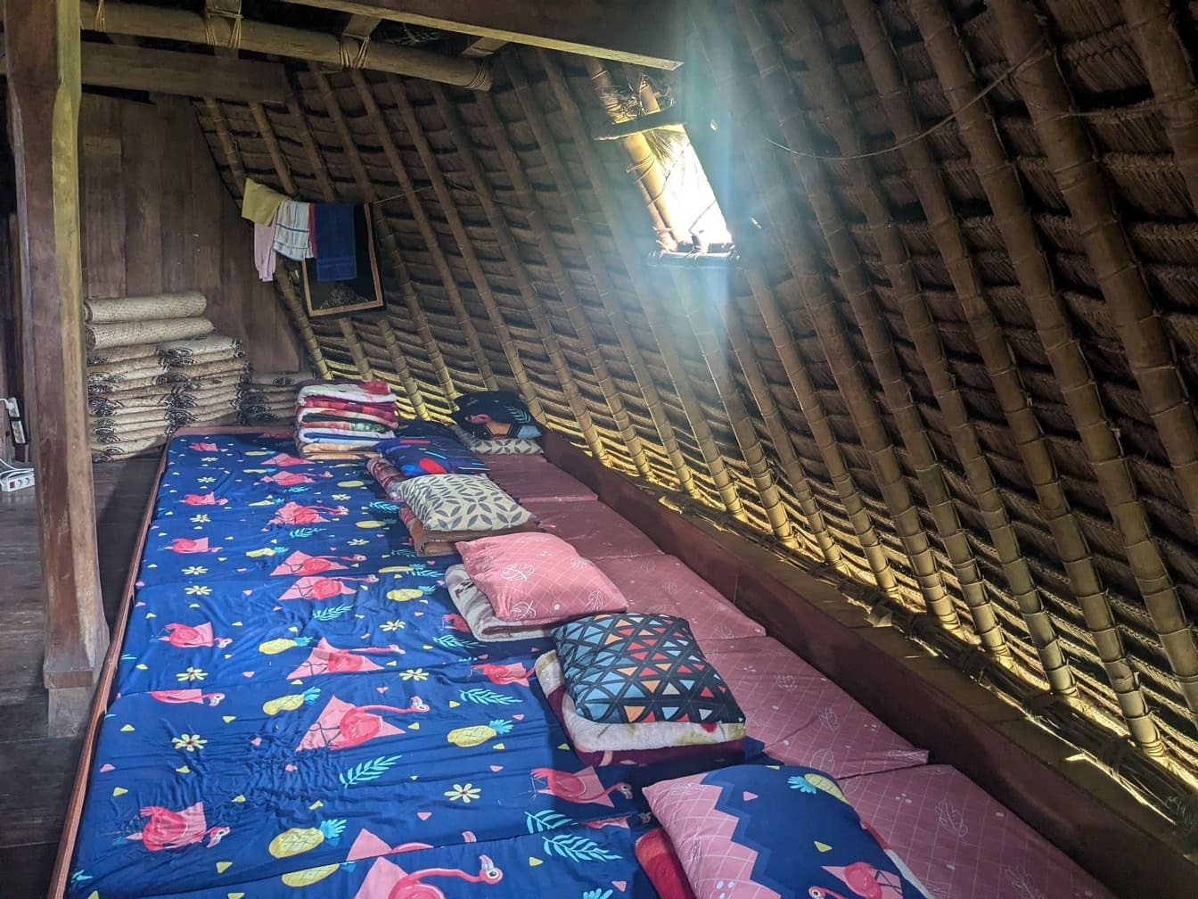 Bungalow in ethno village with beds on the floor, mattress with pillows