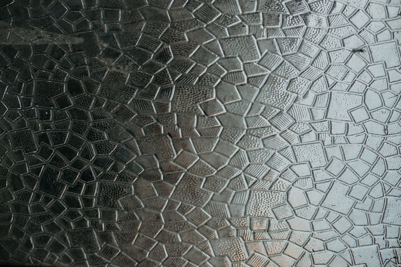 Texture of a semi transparent grey glass with stained glass pattern