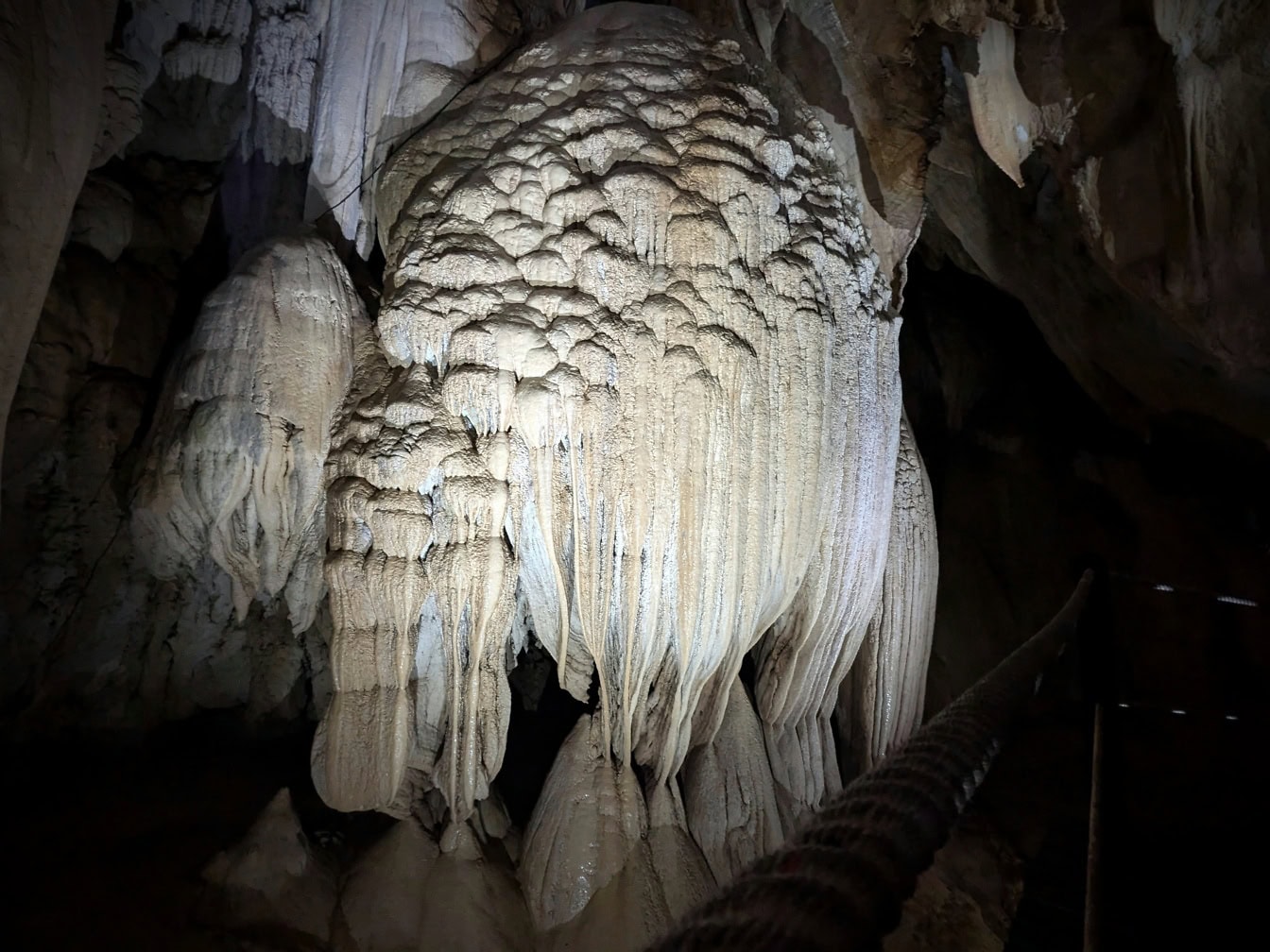 Large formation of a mineral stalactite in a Lang cave in Gunung Mulu national park, Borneo, Mlaysia