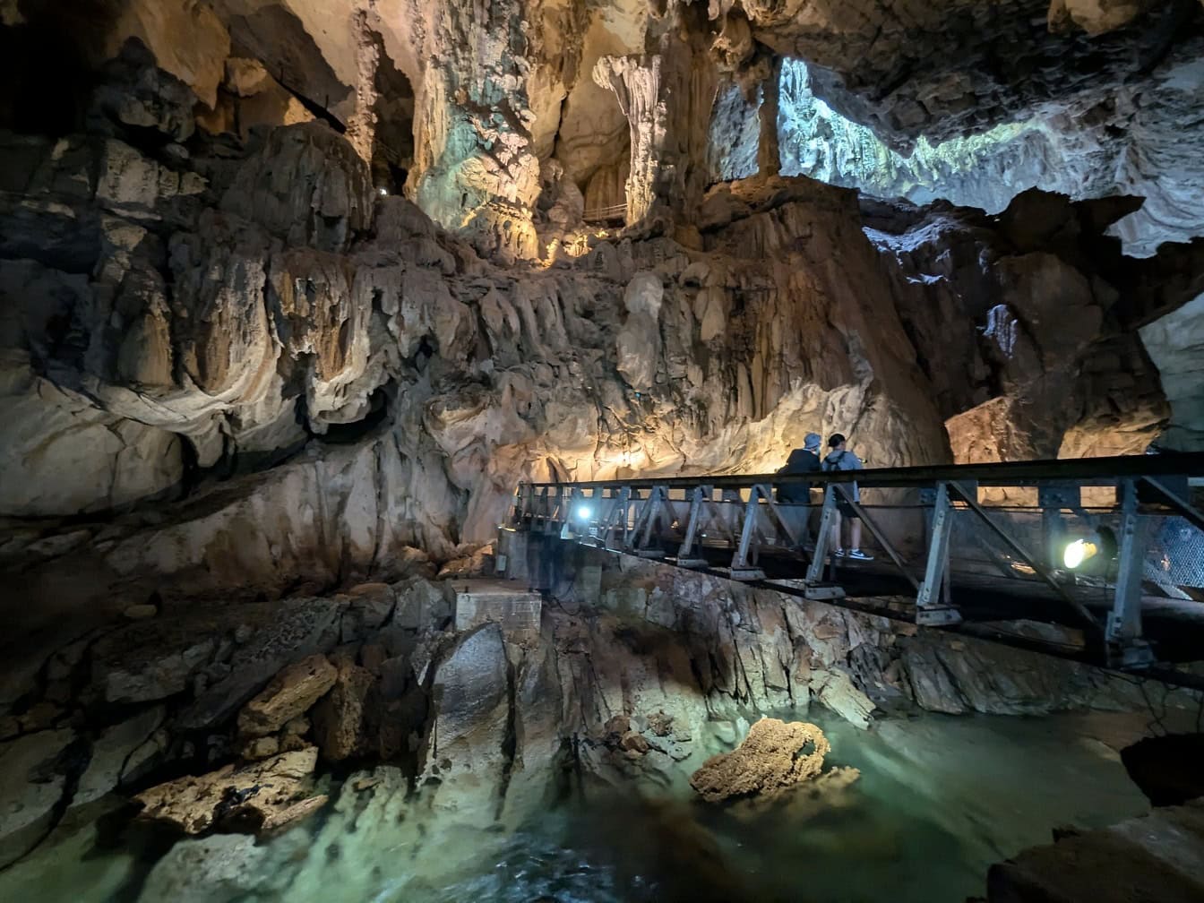 Bridge over a an underground river in a Racer cave in Mulu national park, Sarawak, Malaysia