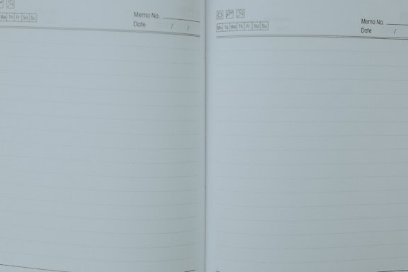 An open notebook with blank white papers with horizontal lines, blank pages of the address book