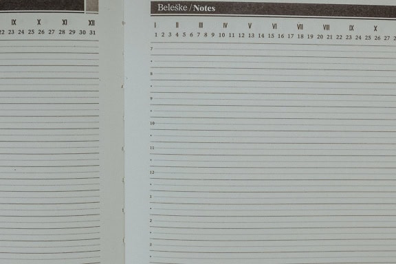 An empty white pages of a notepad with a calendar