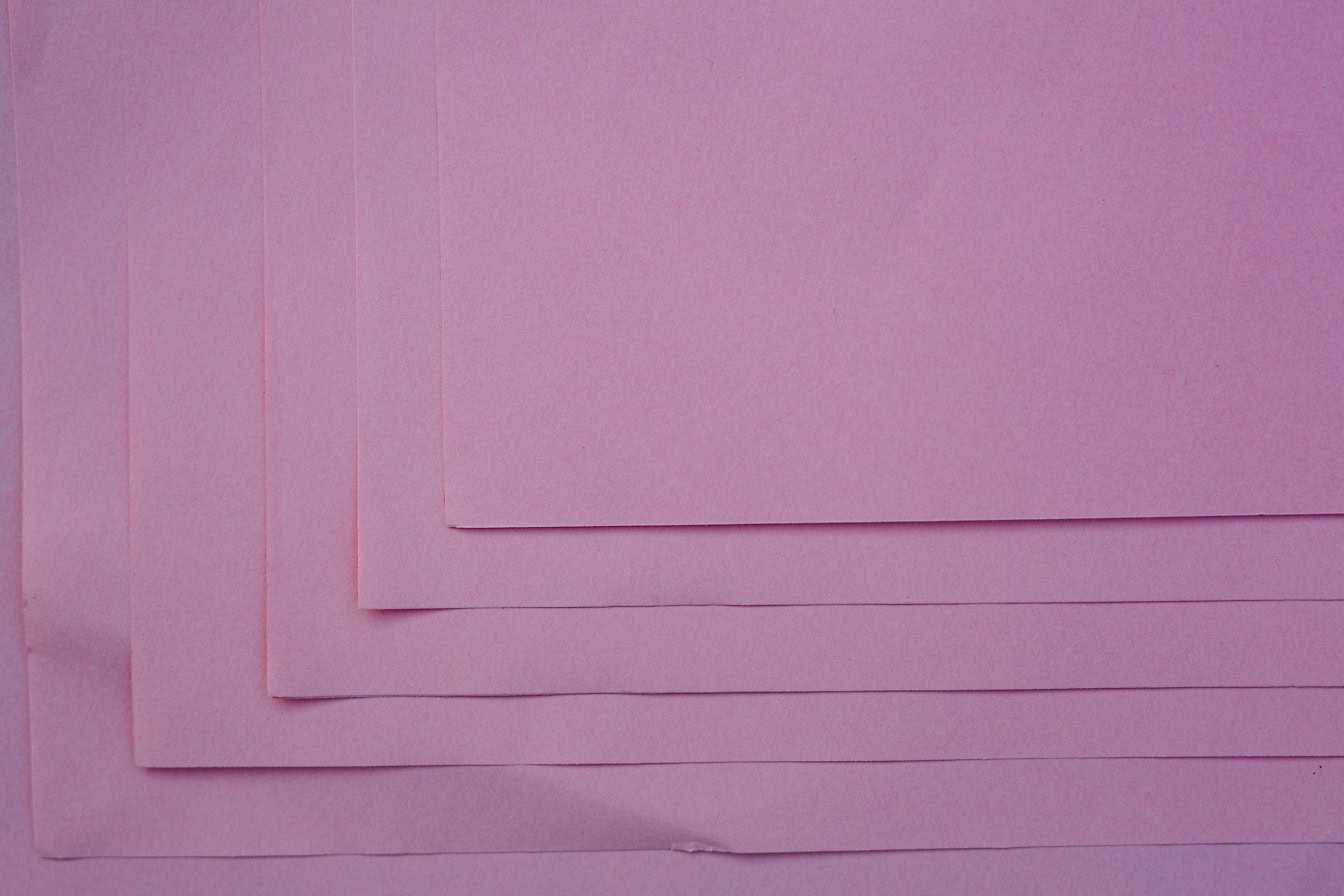 Stack of  blank rectangle pink papers with focus on corners