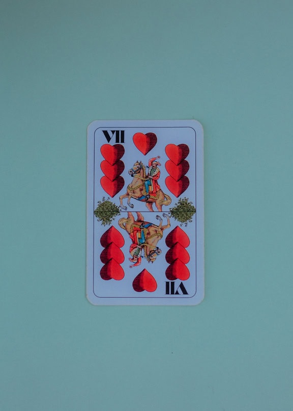 Hungarian playing card with the image of a horse and a heart, seven (7) of hertz