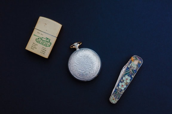 Pocket watch, pocket knife and metal lighter, a display of nostalgic memorabilia