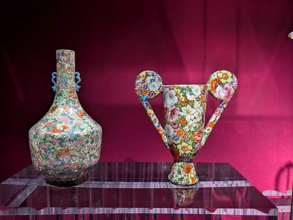 Léopold L. Foulem, a flower vase with neoclassical handles next to porcelain pitcher with floral design, a masterpiece of ceramic