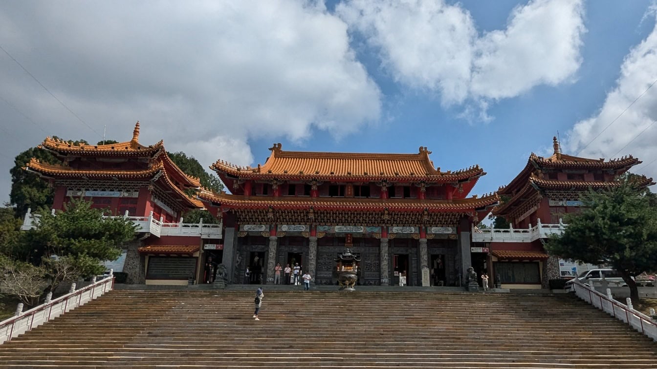 Wen Wu temple, a Confucian temple with a staircase and people walking in front of it, Yuchi Township, Nantou county, Taiwan