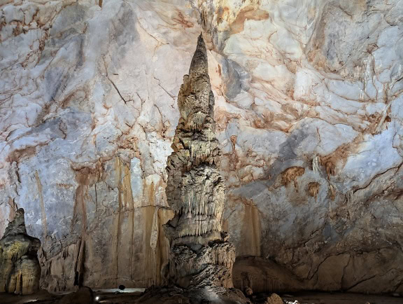 Rock structure in a cave, big stalagmite in the Paradise cave, a limestone cave in Phong Nha Ke Bang national park in Vietnam