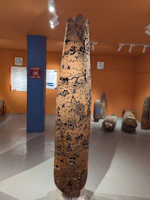 An obelisk or cylindrical sculptures in museum, Bouunpaul Phothyzan a Lao artist made statues from grenade shells, Luang Prabang, Laos