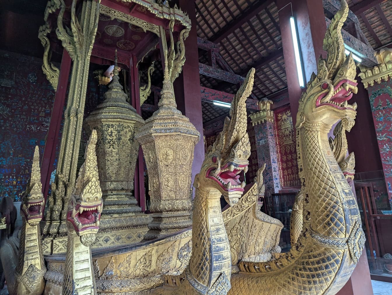 Sculpture of gold dragons on a royal funeral carriage at the Wat Xieng Thong a Buddhist temple, Luang Prabang, Laos