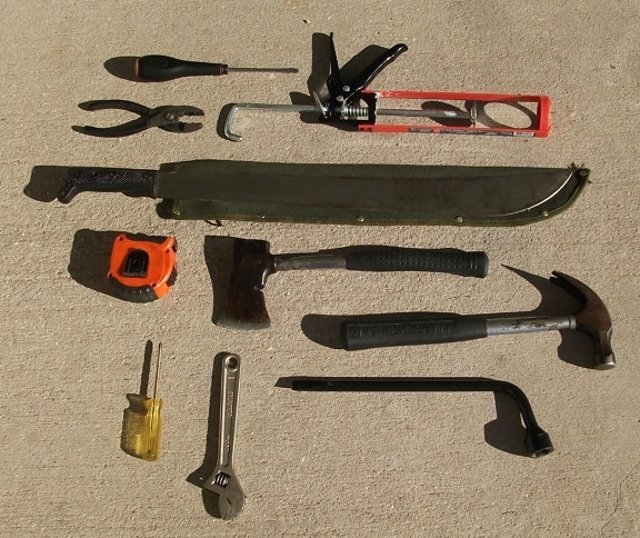 hatchet, screwdriver, hand tool, meter, hammer,  various tools, screwdriver, saw