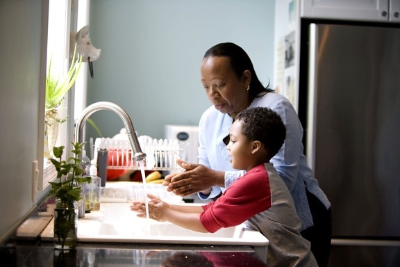 African American, mother, shown, process, teaching, young son, wash