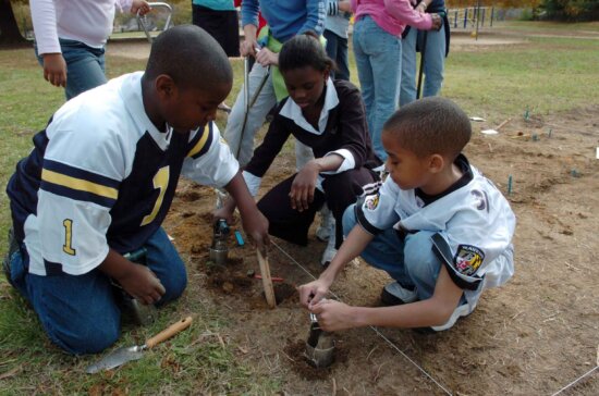children, measuring, hole, deep, enough, planting, flowers