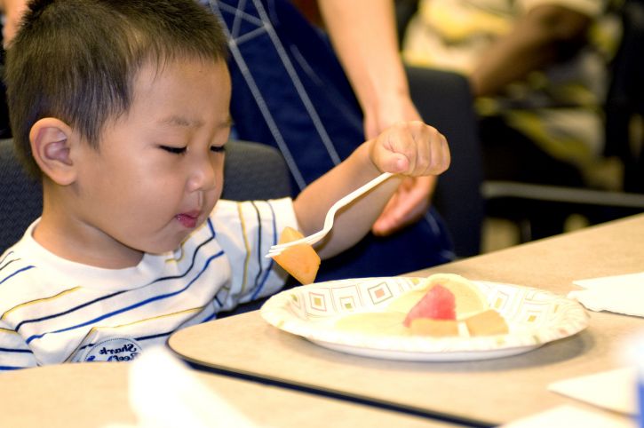 cute, young boy eating