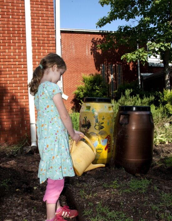 school girl, yellow, colored, plastic, watering, canister