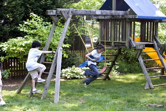 two, young children, play, wooden, swing, set