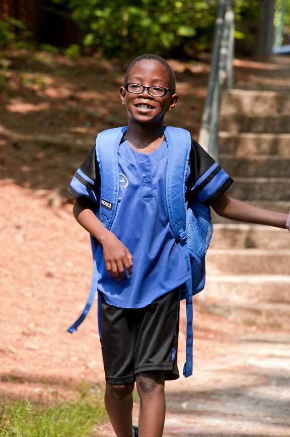 young, African American, school boy, walking