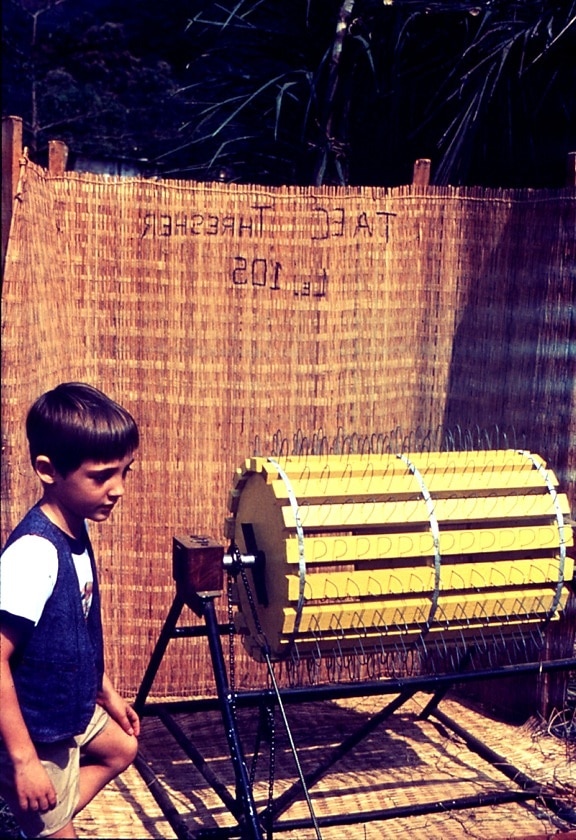 young boy, rice, processing, machine, Sierra Leone, Africa