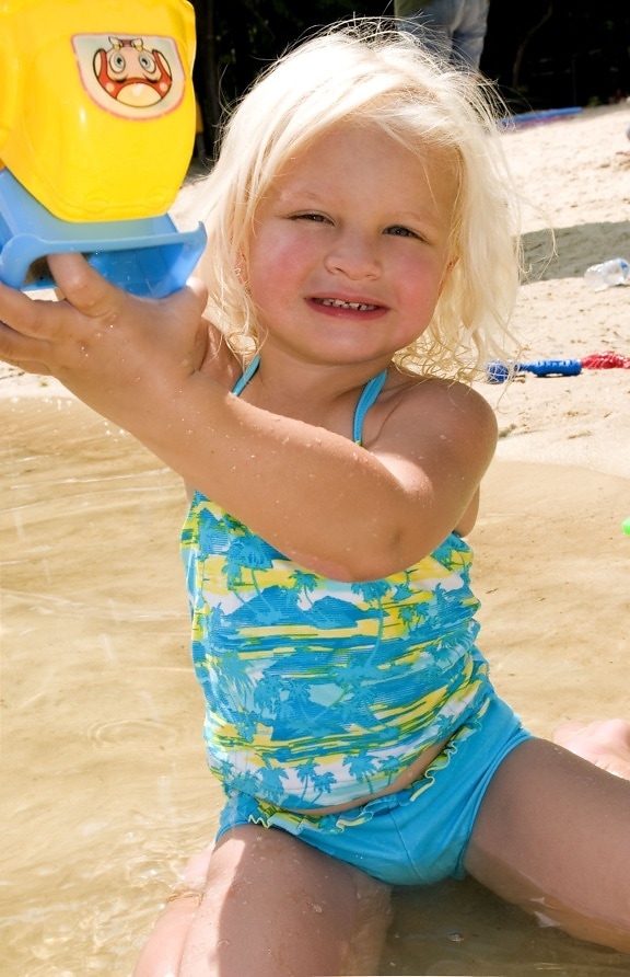 young girl, wading, water, lake, shoreline, swimsuit