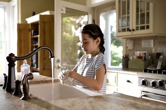 young girl, shown, process, washing, hands, kitchen, sink
