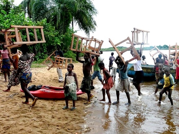 carpenters, fisherman, peacekeepers, students, collaborate, desks, rural, schools, Liberia