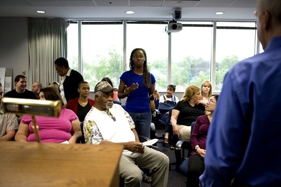 man, meeting, question, posed, participating, African American, woman