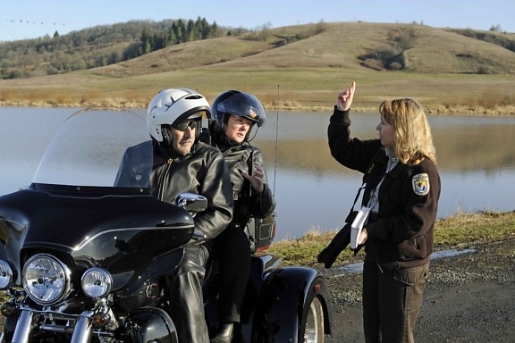 female, speaks, persons, motorcycle