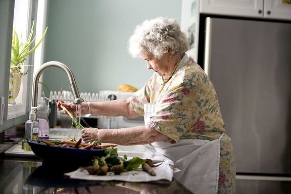 elderly, woman, kitchen, cleaning, carrots, radishes