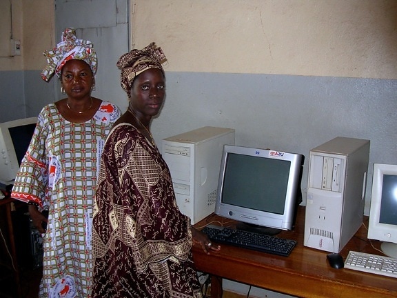 two, women, community, radio, station, stands, computers, access, internet