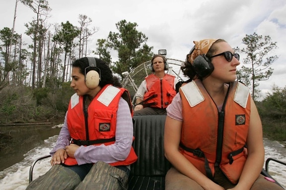 two, young, women, wearing, ear, protection, driven, volunteer, destination, air, boat