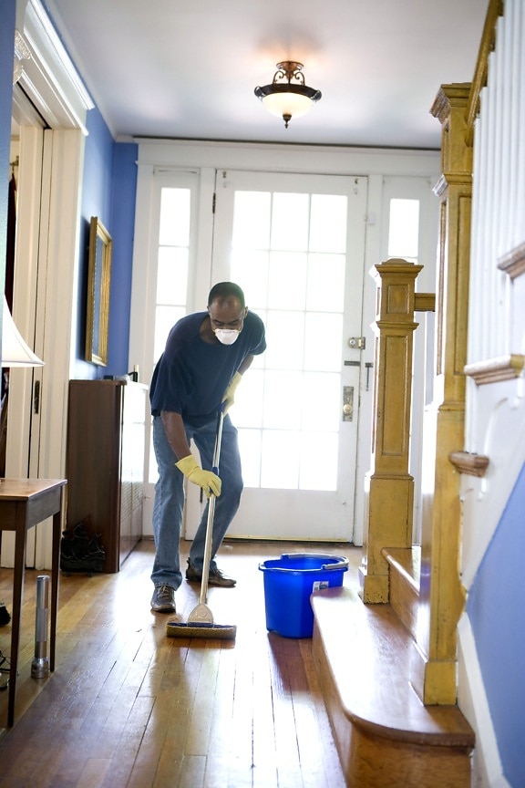 African American, man, personal, protective, equipment, cleaning, home, damp, mop