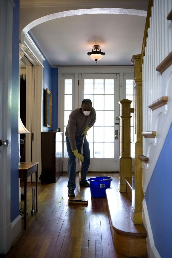 African American, man, process, damp, mopping, home, entrance