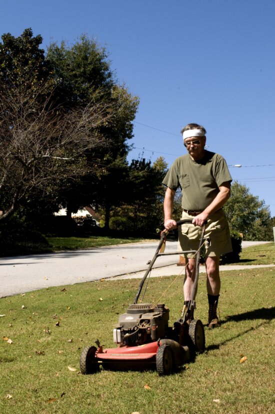 man, mowing, front, lawn, push, lawnmower