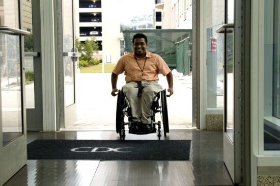 sitting, wheelchair, triggered, mechanized, doors, open