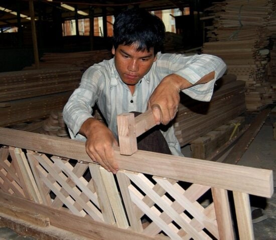 young man, learns, carpentry, trade, discovers, path, poverty, USAID