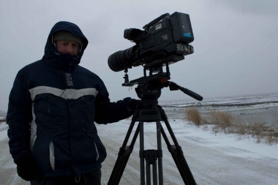 videographer, filming, snowy, day
