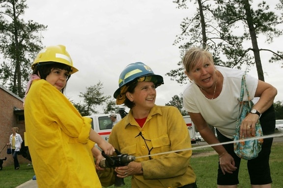 mother, daughter, playing, firefighter