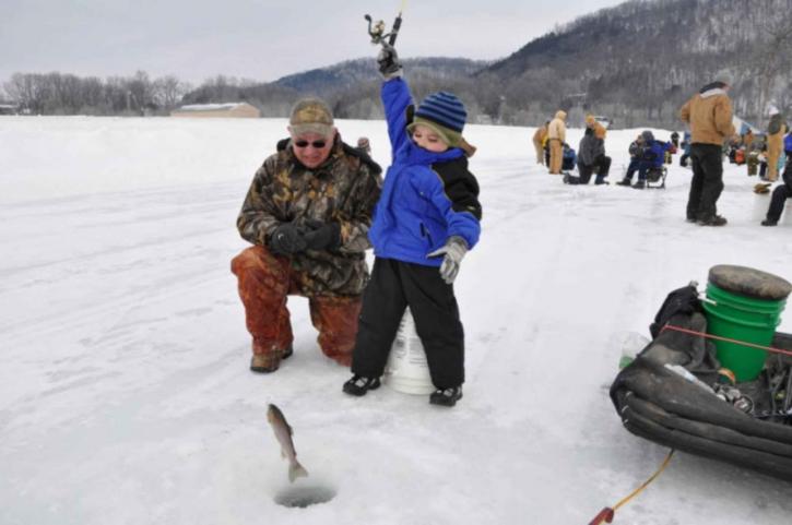 young boy, father, enjoying, winter, ice, fishing