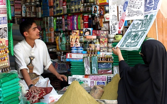 young man, store, small market, Yemen, woman, items