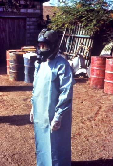 field, technician, demonstrating, protective, clothing, gown, gloves, mask