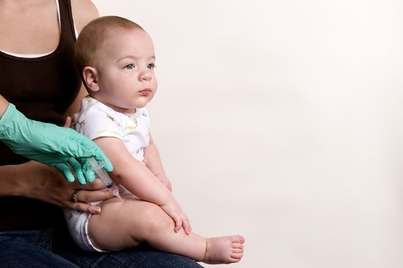baby, receiving, scheduled, vaccine
