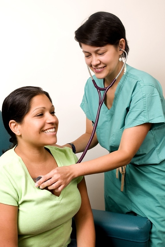 female, clinician, dressed, scrubs, stethoscope