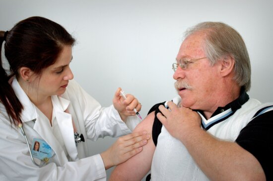 middle, aged, man, receiving, intramuscular, immunization, shoulder, muscle, female, nurse