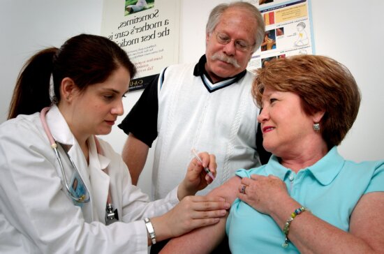 middle, aged, woman, receiving, intramuscular, vaccination, shoulder