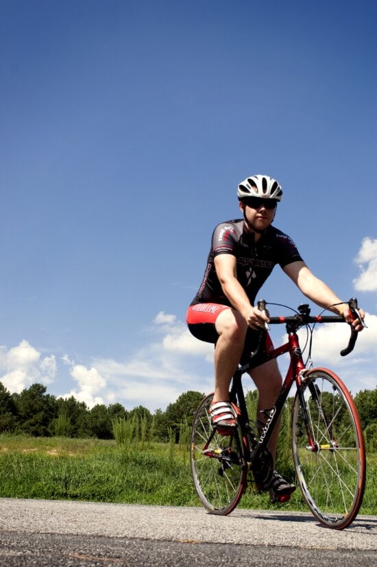 bicyclist, streamline, aerodynamically, designed, helmet, sunglasses, skin, tight, riding