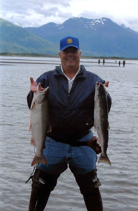 fisherman, holds, fish, silver, coho, salmon