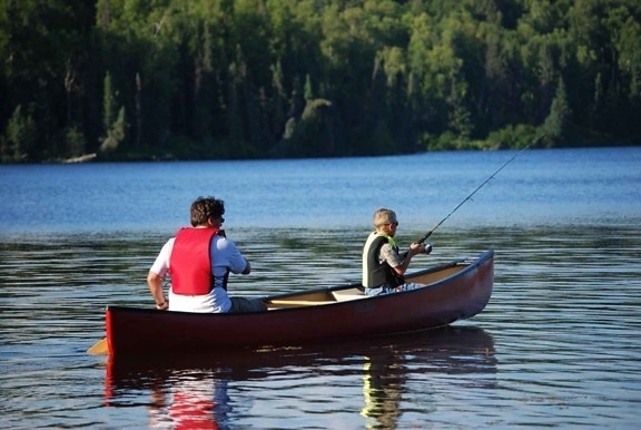 man, child, fish, canoe