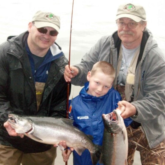 two, men, young boy, fishing