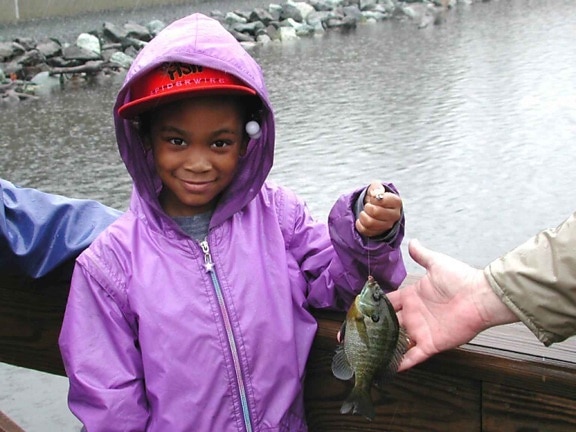 young, African, American, girl, smile, holding, fishing, catch